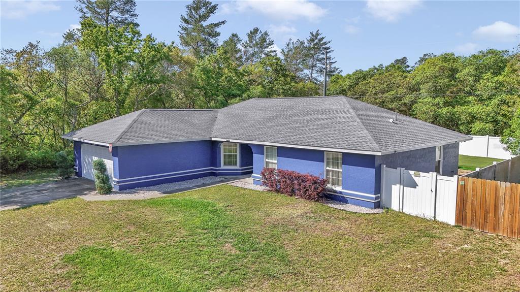13800 Southwest 33rd Court Road Ocala, FL 34473 - Photo 7 of 42 front view of a house with a yard