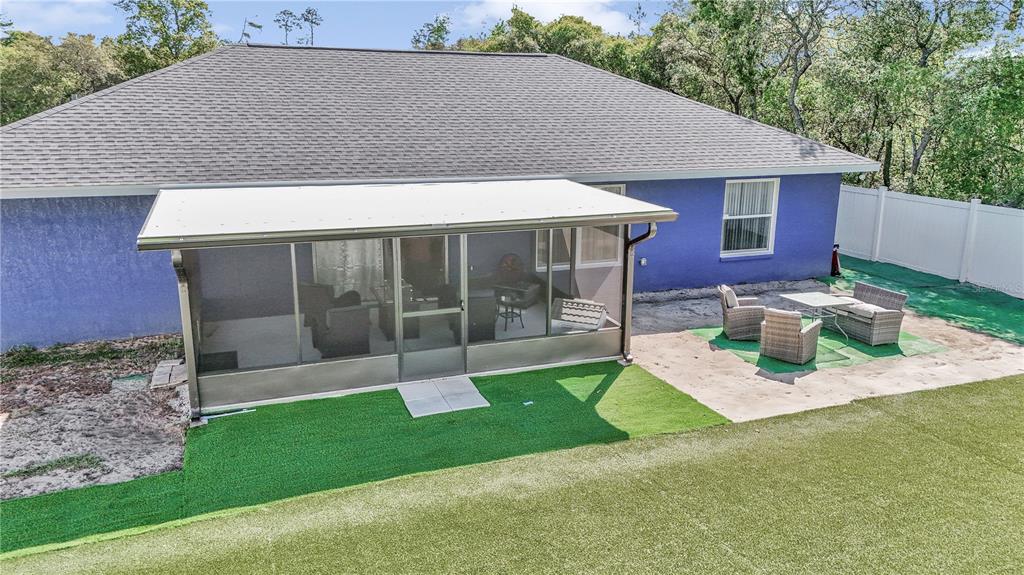 13800 Southwest 33rd Court Road Ocala, FL 34473 - Photo 9 of 42 a view of a house with backyard porch and sitting area