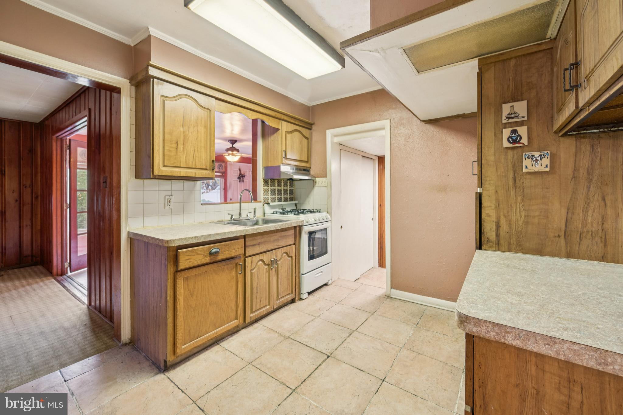 4817 Browning Road Pennsauken, NJ 08109 - Photo 19 of 25 a kitchen with granite countertop a sink and cabinets