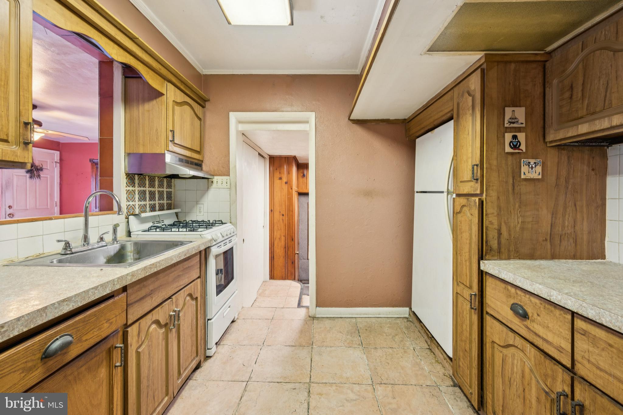 4817 Browning Road Pennsauken, NJ 08109 - Photo 20 of 25 a kitchen with granite countertop a sink and refrigerator
