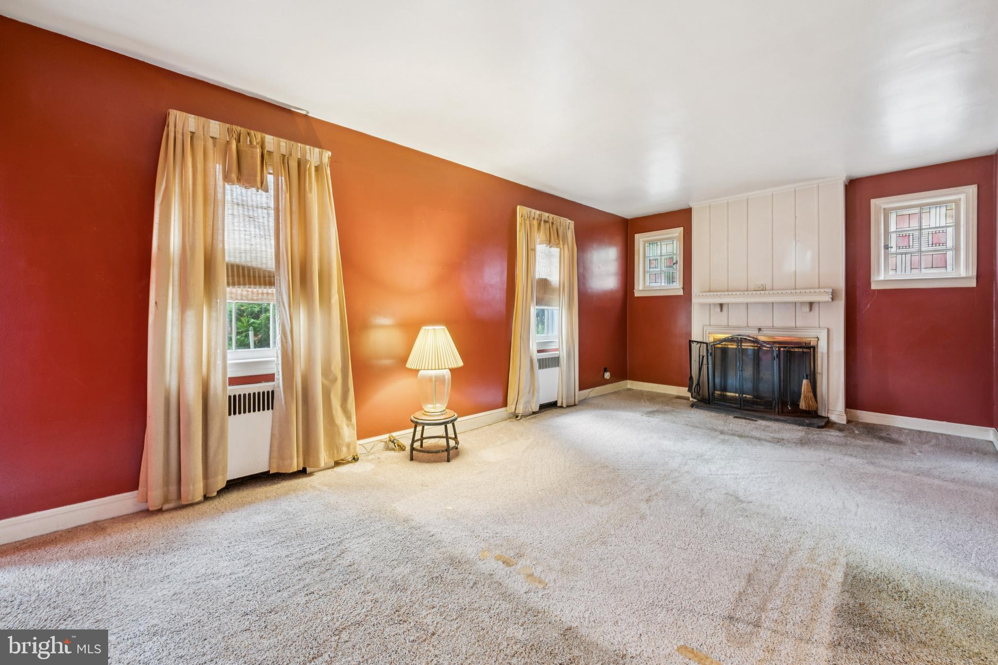 4817 Browning Road Pennsauken, NJ 08109 - Photo 6 of 25 an empty room with furniture and a fireplace