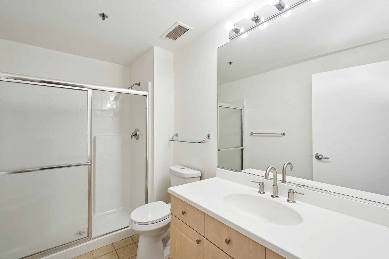 3500 South Sangamon Street, Unit 401 Chicago, IL 60609 - Photo 12 of 18 a bathroom with a sink toilet and shower