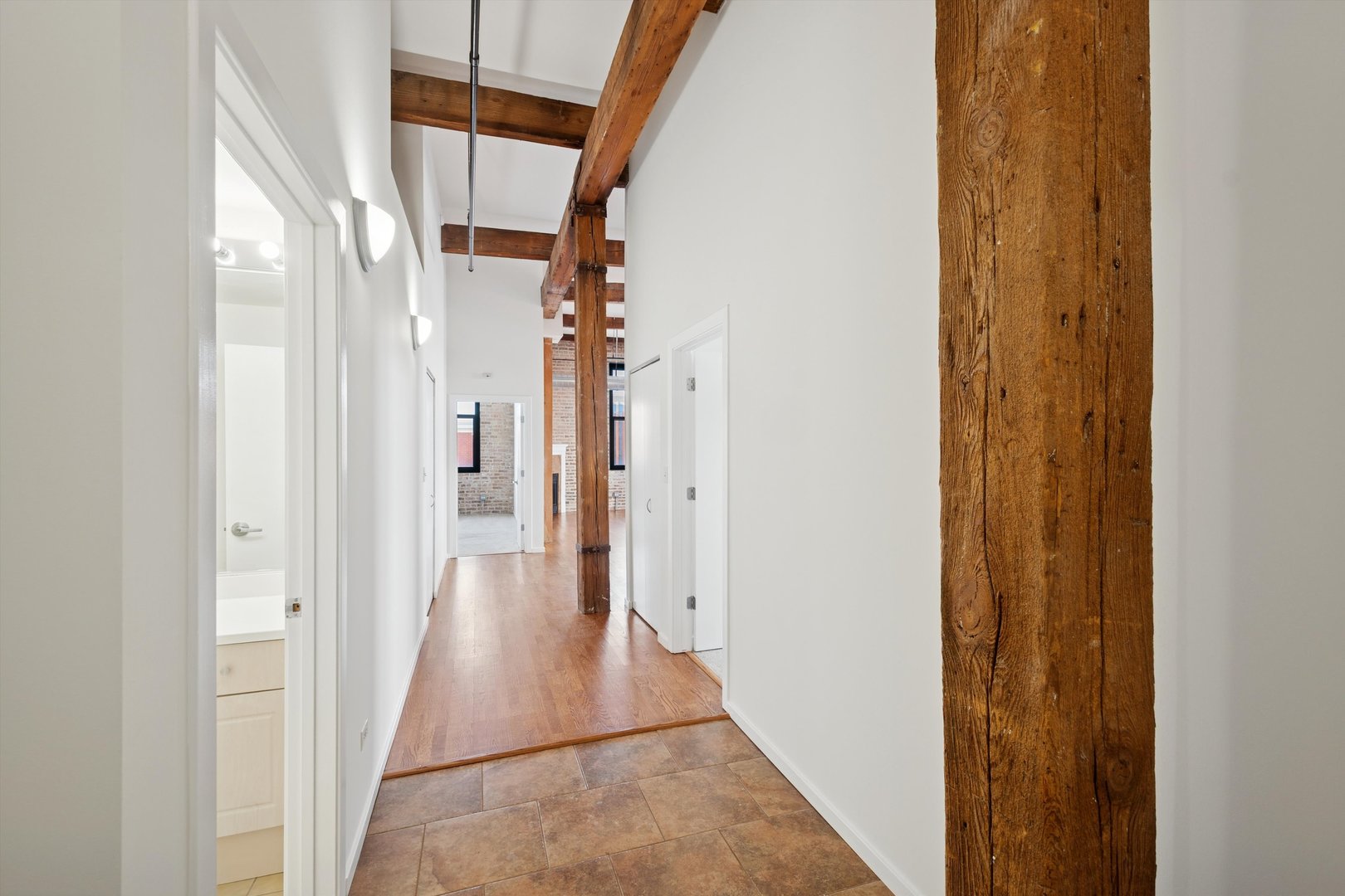 3500 South Sangamon Street, Unit 401 Chicago, IL 60609 - Photo 10 of 18 a view of a hallway with wooden floor and staircase