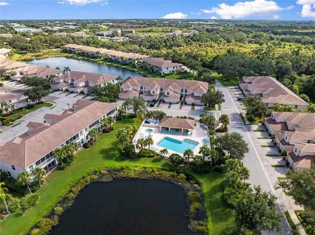 an aerial view of house with yard swimming pool and outdoor seating