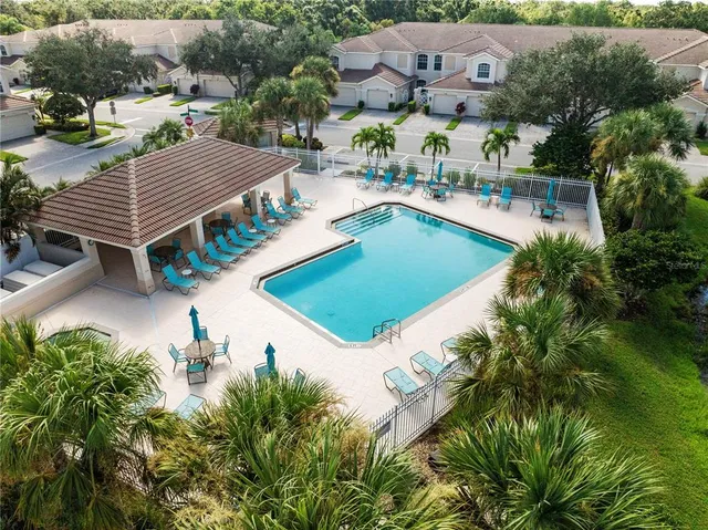 a view of a house with a floor to ceiling window and a basket ball poll