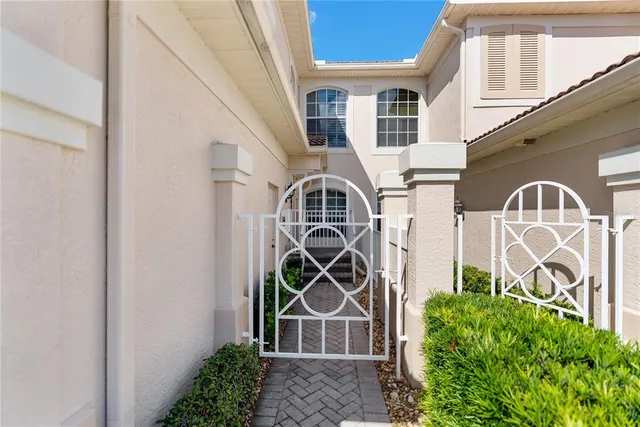 a bedroom with bed and a chandelier