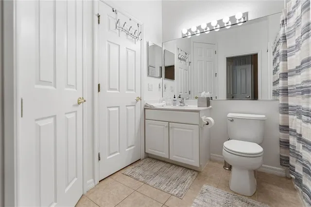 a bed room with a bed and a television