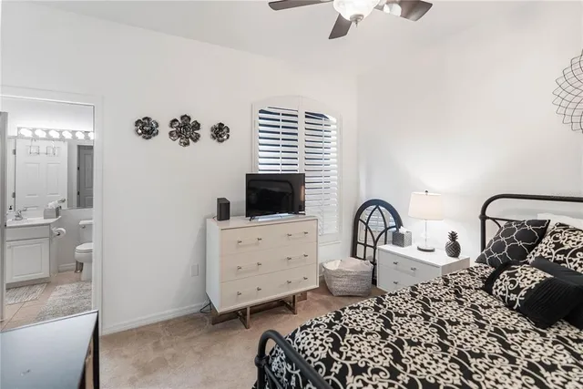 a bathroom with a tub a sink and mirror