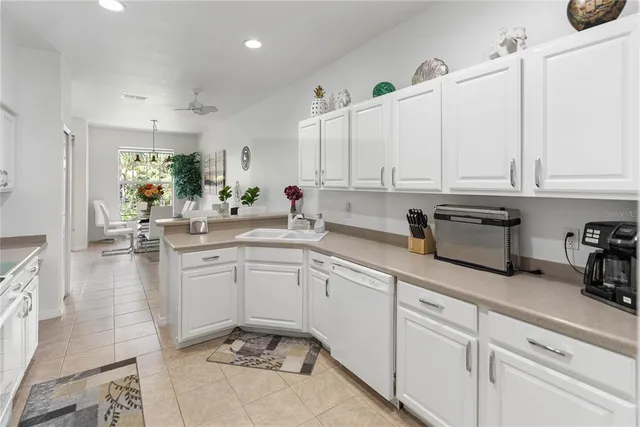a kitchen with sink cabinets and window