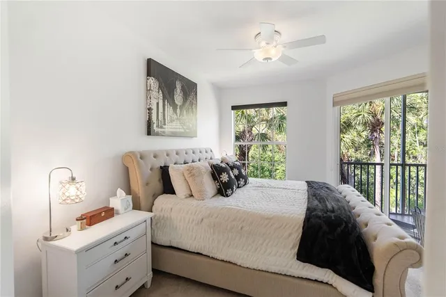 a bedroom with a bed and a night stand