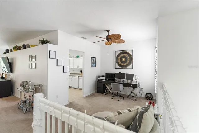 a bedroom with furniture and a flat screen tv