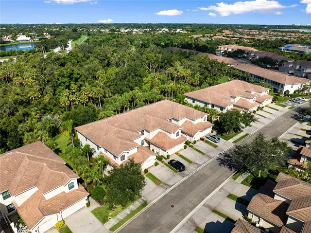 an aerial view of residential houses with outdoor space