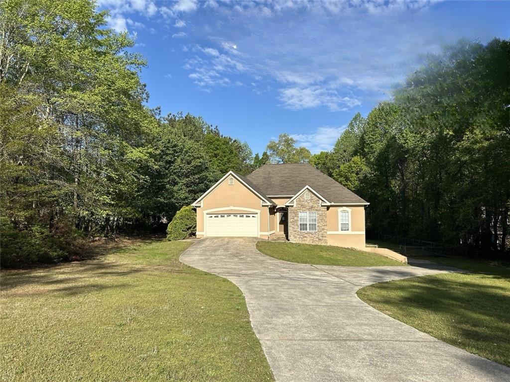 a front view of a house with a yard