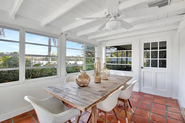 a view of a dining room with furniture window and outside view
