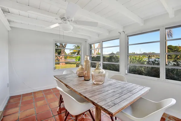 a dining room with a table and chairs