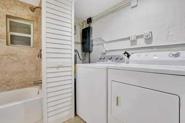 a utility room with dryer and washer