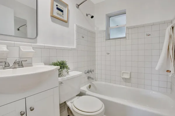 a bathroom with a sink toilet and bathtub