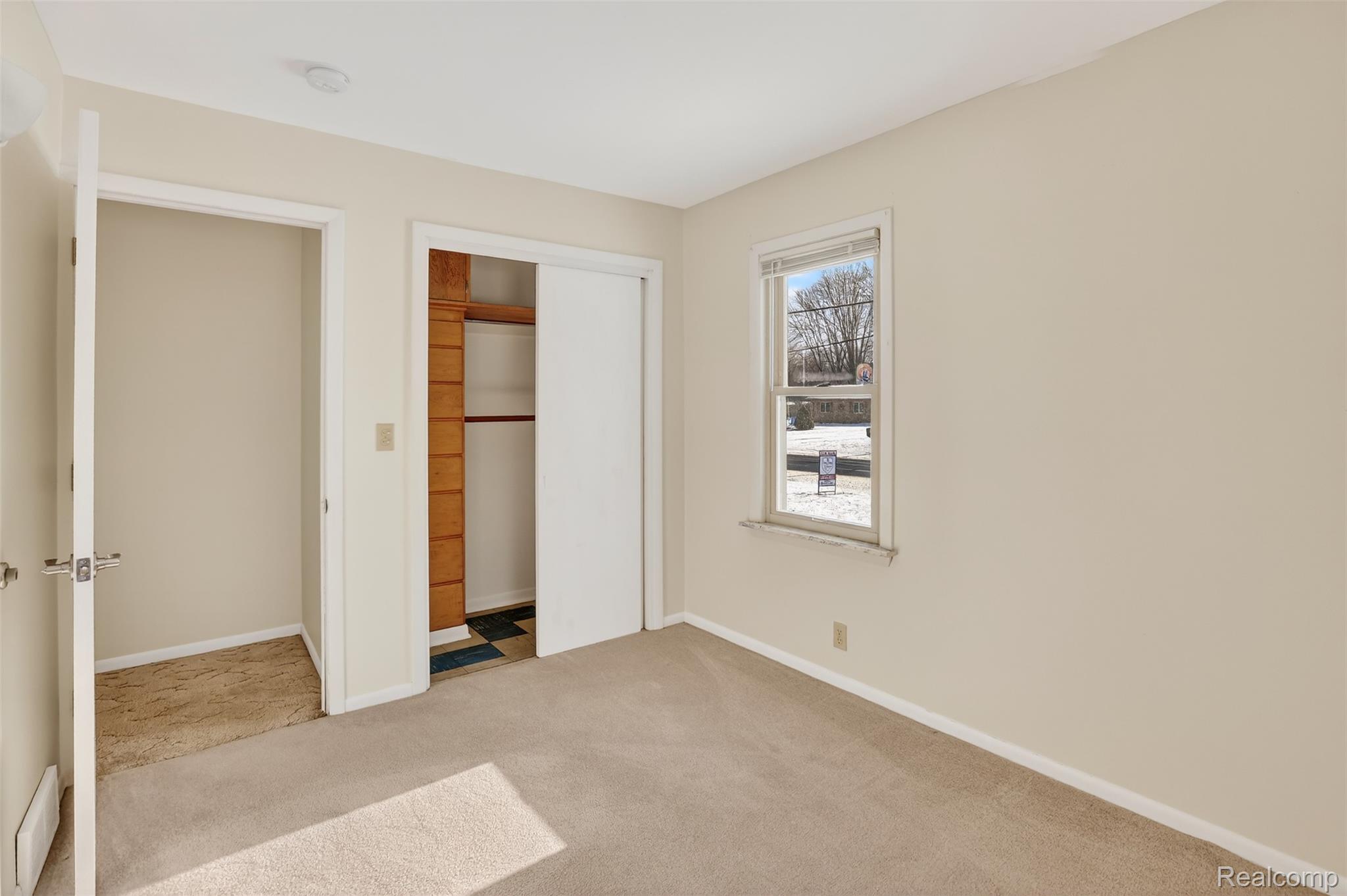 3241 Curtis Road Birch Run, MI 48415 - Photo 29 of 47 Unfurnished bedroom featuring light carpet and a closet