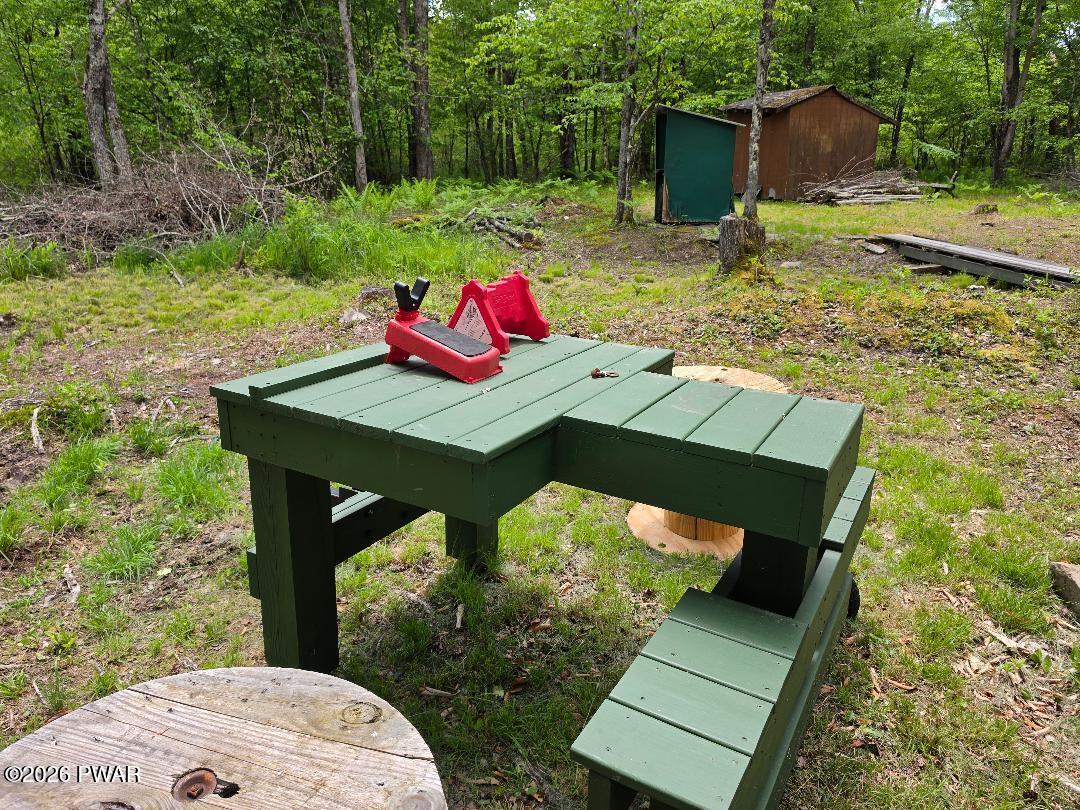 94 Swamp Road Pleasant Mount, PA 18453 - Photo 20 of 33 a view of a chairs and table in the backyard