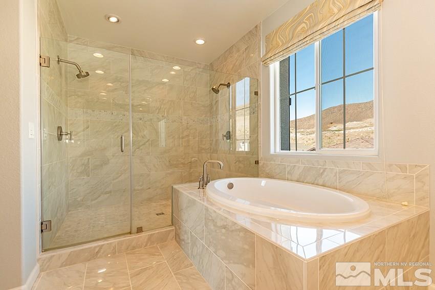 3190 Show Jumper Lane Reno, NV 89521 - Photo 12 of 32 a spacious bathroom with a tub shower and sink