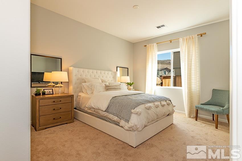 3190 Show Jumper Lane Reno, NV 89521 - Photo 13 of 32 a bedroom with a bed and a couch