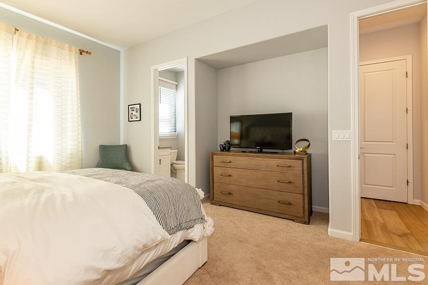3190 Show Jumper Lane Reno, NV 89521 - Photo 14 of 32 a bedroom with a bed and flat screen tv
