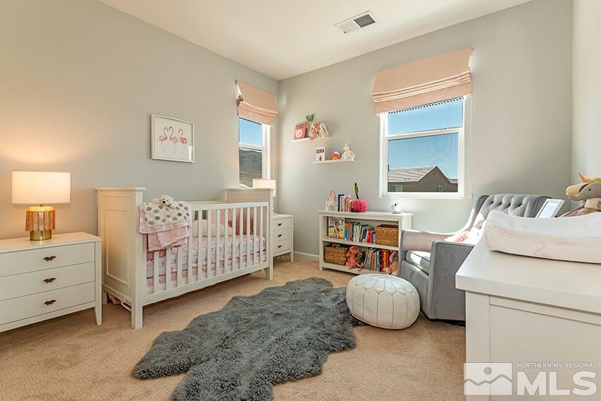 3190 Show Jumper Lane Reno, NV 89521 - Photo 20 of 32 a bedroom with a bed and a window