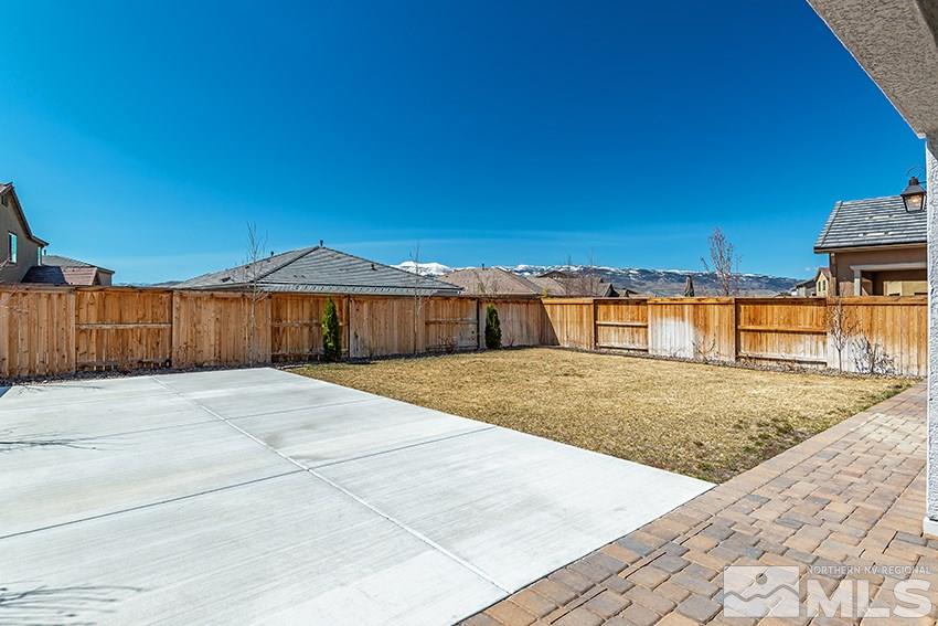 3190 Show Jumper Lane Reno, NV 89521 - Photo 24 of 32 a view of a swimming pool with a yard