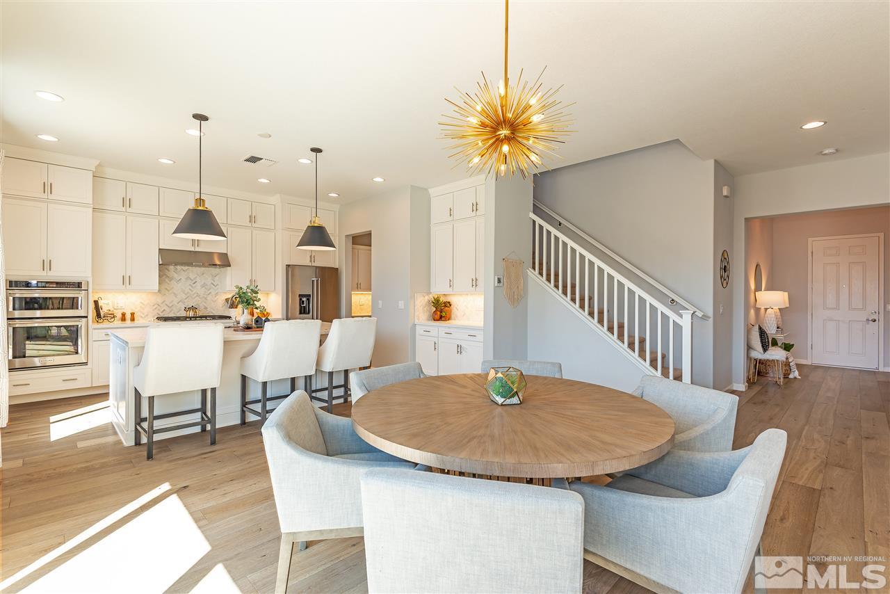 3190 Show Jumper Lane Reno, NV 89521 - Photo 3 of 32 a dining room with furniture and wooden floor