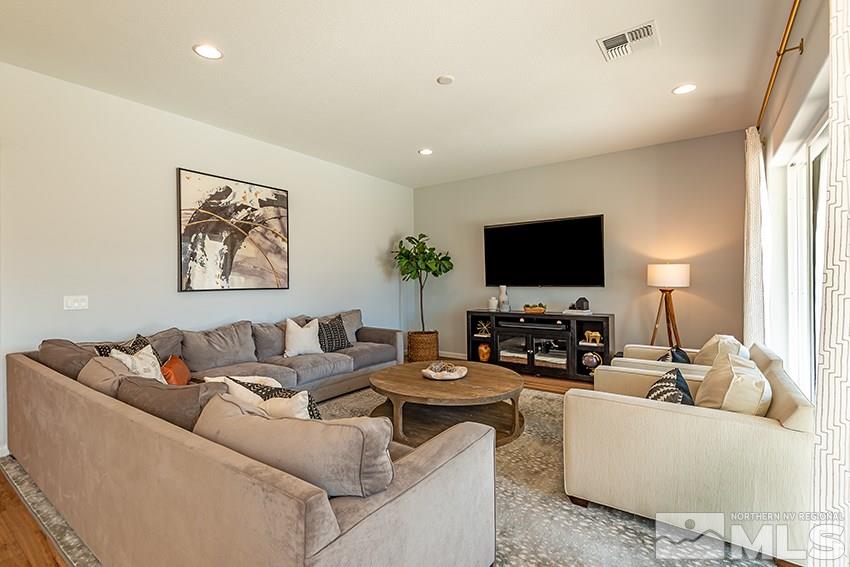 3190 Show Jumper Lane Reno, NV 89521 - Photo 6 of 32 a living room with furniture and a flat screen tv