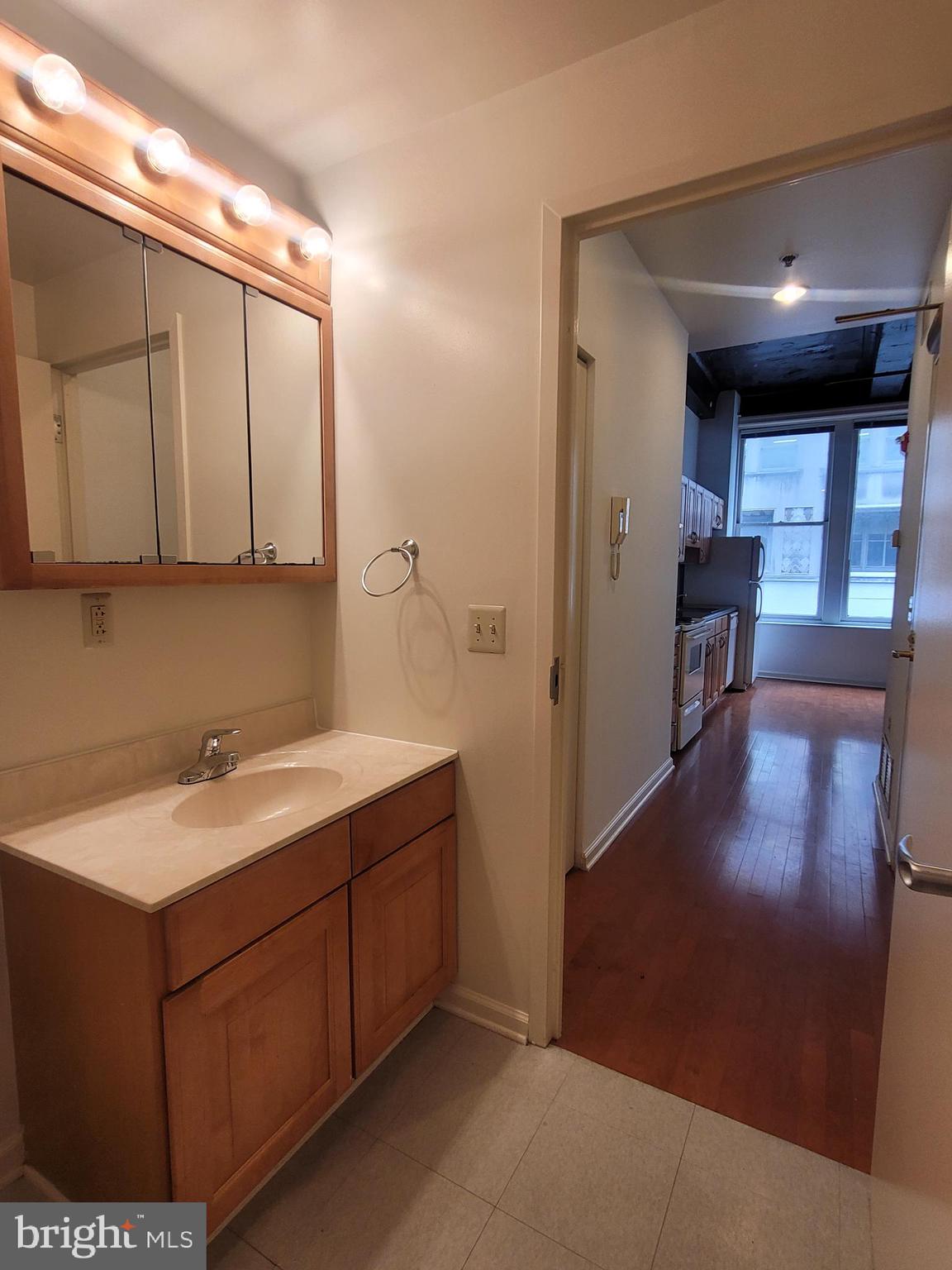 1427 Walnut Street, Unit 3F Philadelphia, PA 19102 - Photo 11 of 14 a bathroom with a sink and a mirror