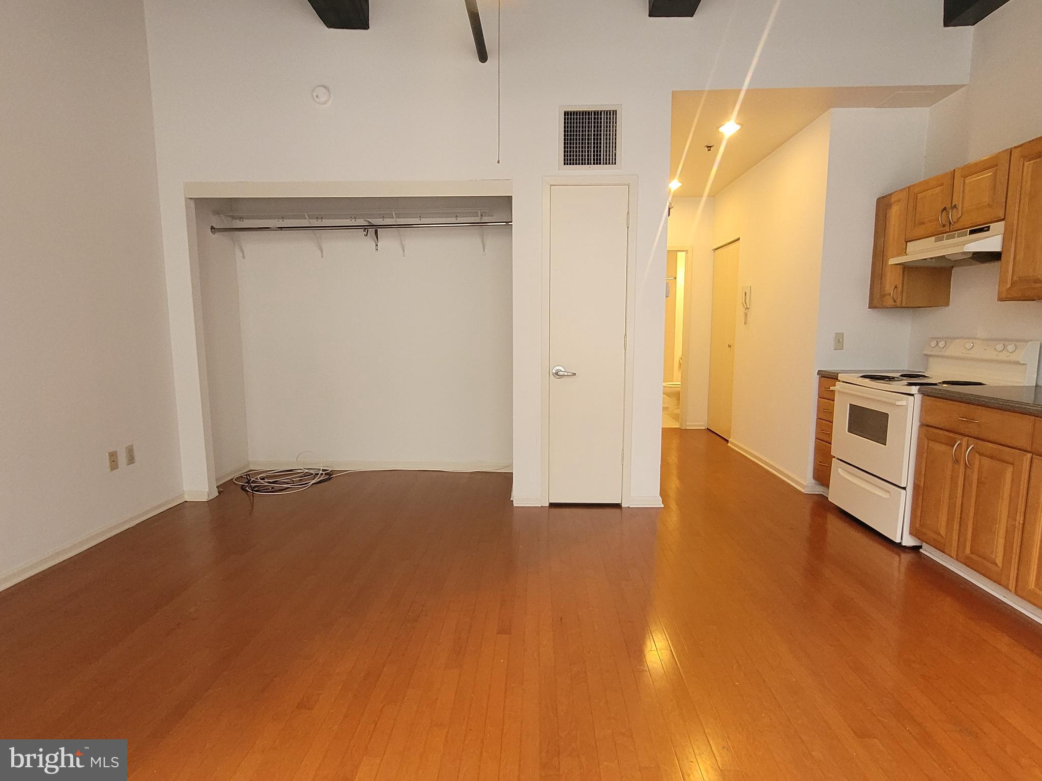 1427 Walnut Street, Unit 3F Philadelphia, PA 19102 - Photo 5 of 14 a view of a kitchen with a sink and a refrigerator