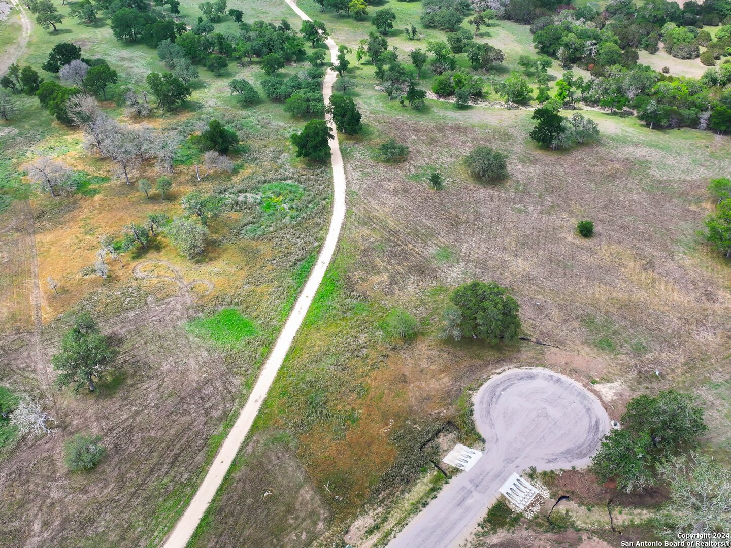 Lot 169 Coldwater Drive Center Point, TX 78010 - Photo 14 of 25 a backyard of a house with a yard and outdoor seating
