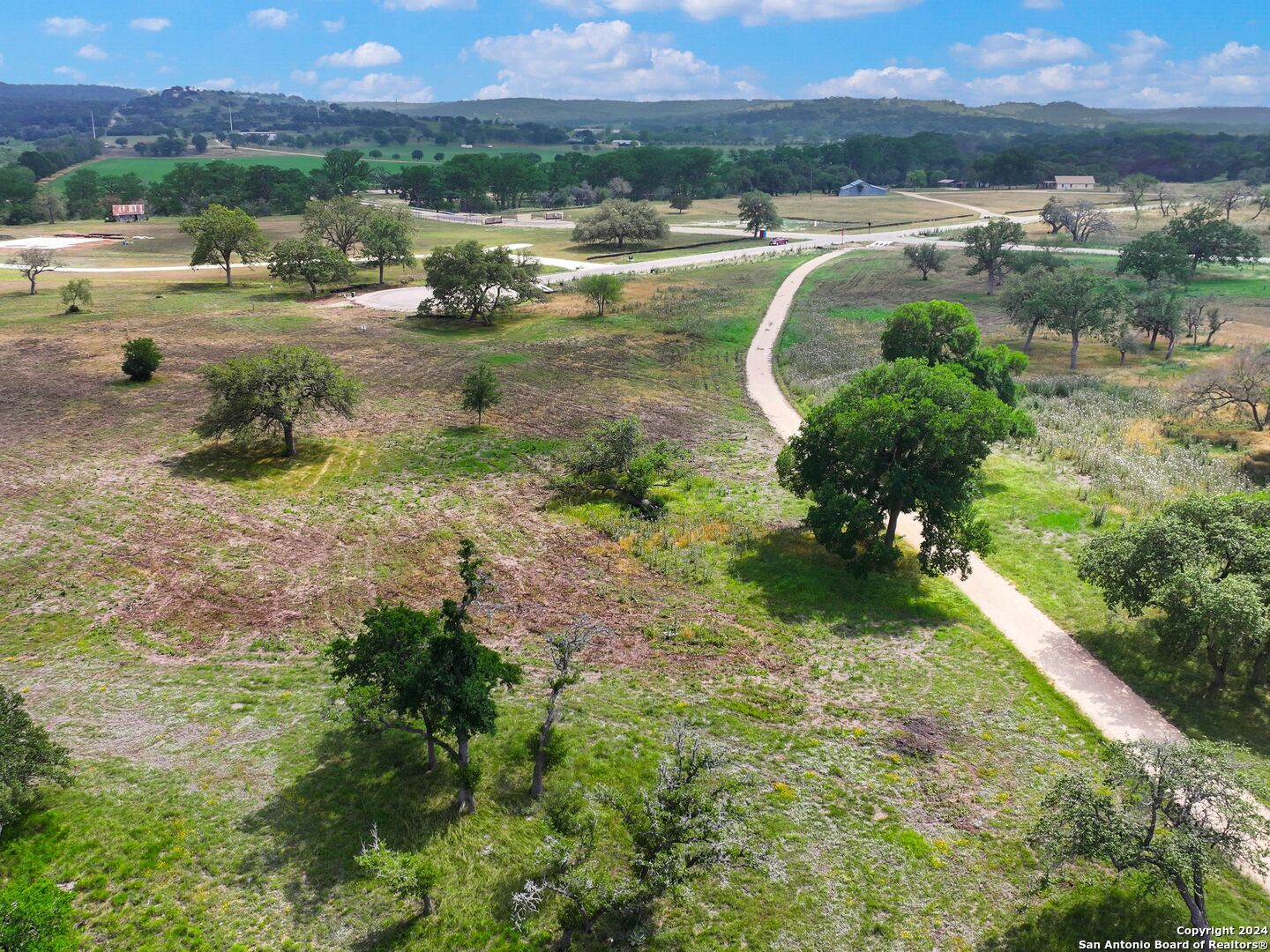 Lot 169 Coldwater Drive Center Point, TX 78010 - Photo 17 of 25 a view of a lake with a yard and mountain