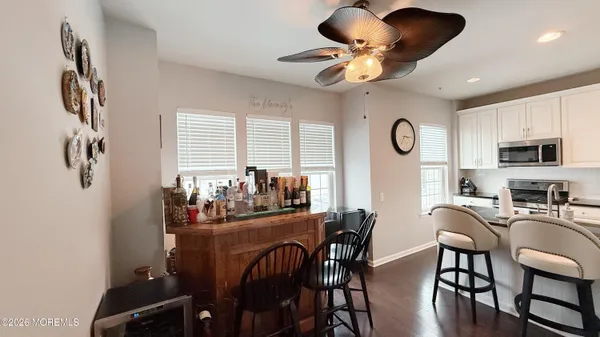 a kitchen with a sink appliances and cabinets