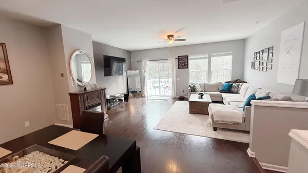 a view of a dining room with furniture window and wooden floor