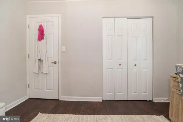 a view of entryway with wooden floor
