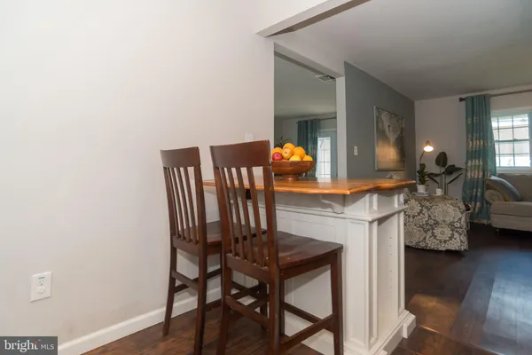 a view of a livingroom with furniture and wooden floor