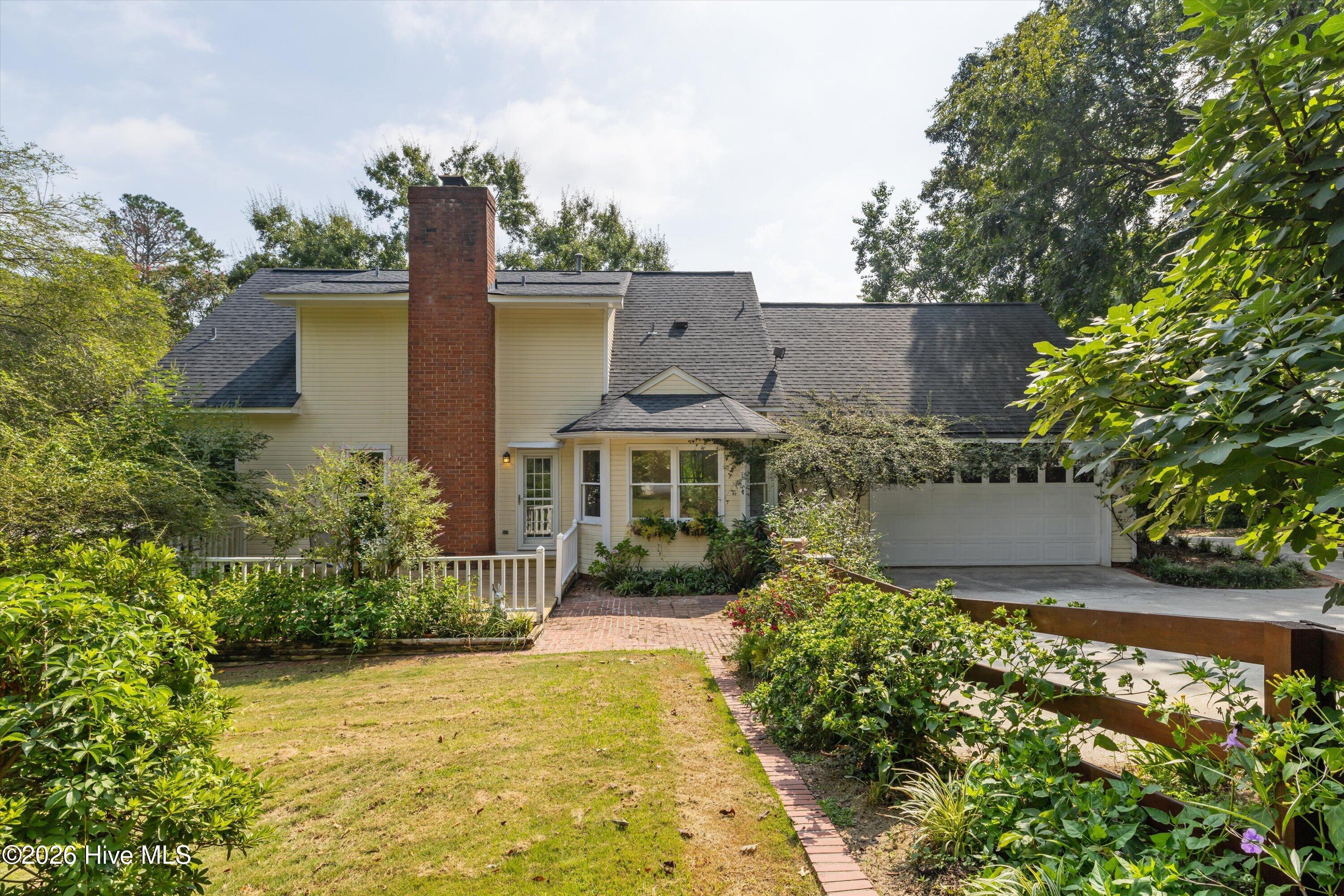 200 Watervale Road Martinez, GA 30907 - Photo 25 of 35 Back of Home with Vibrant Flora