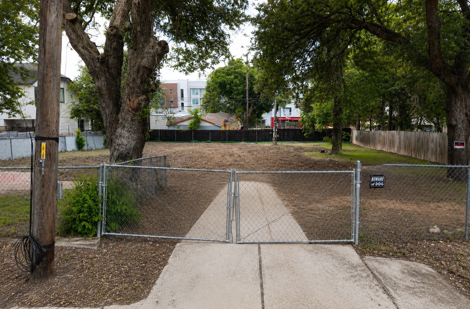2017 East 8th Street Austin, TX 78702 - Photo 3 of 7 A fenced, level lot with mature trees presents a prime building opportunity.
