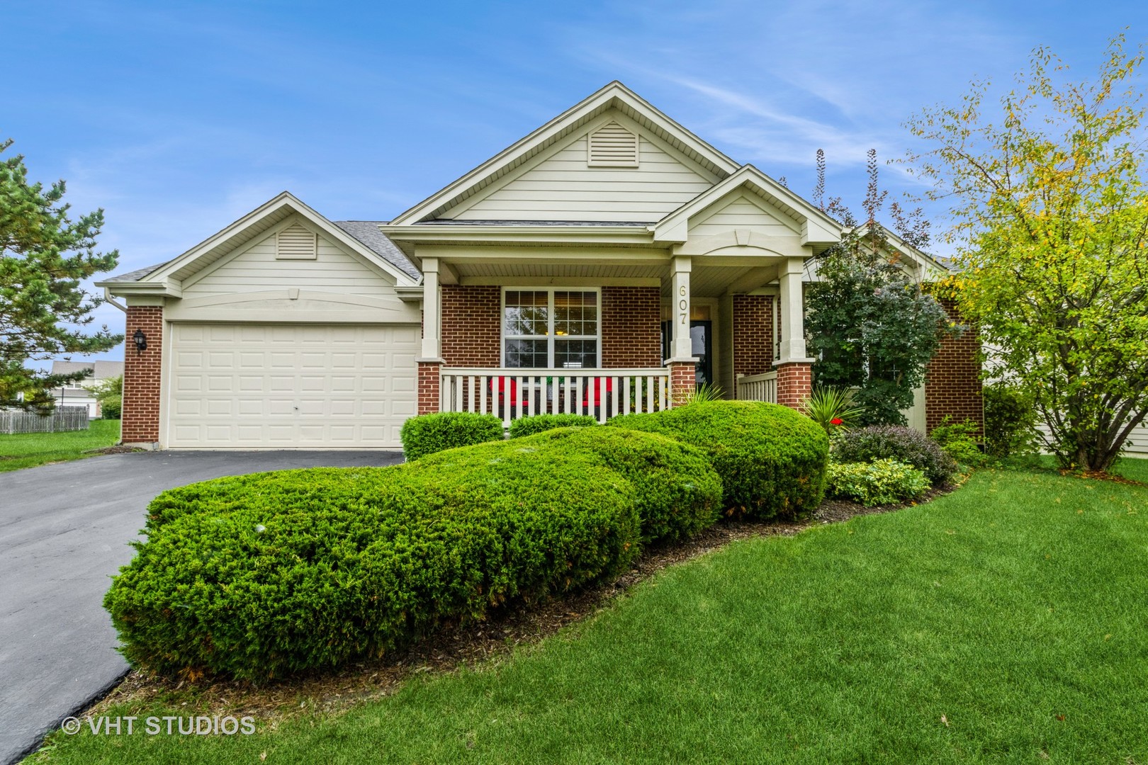 607 Waterford Road Elgin, IL 60124 - Photo 1 of 34 a front view of a house with a yard and garage