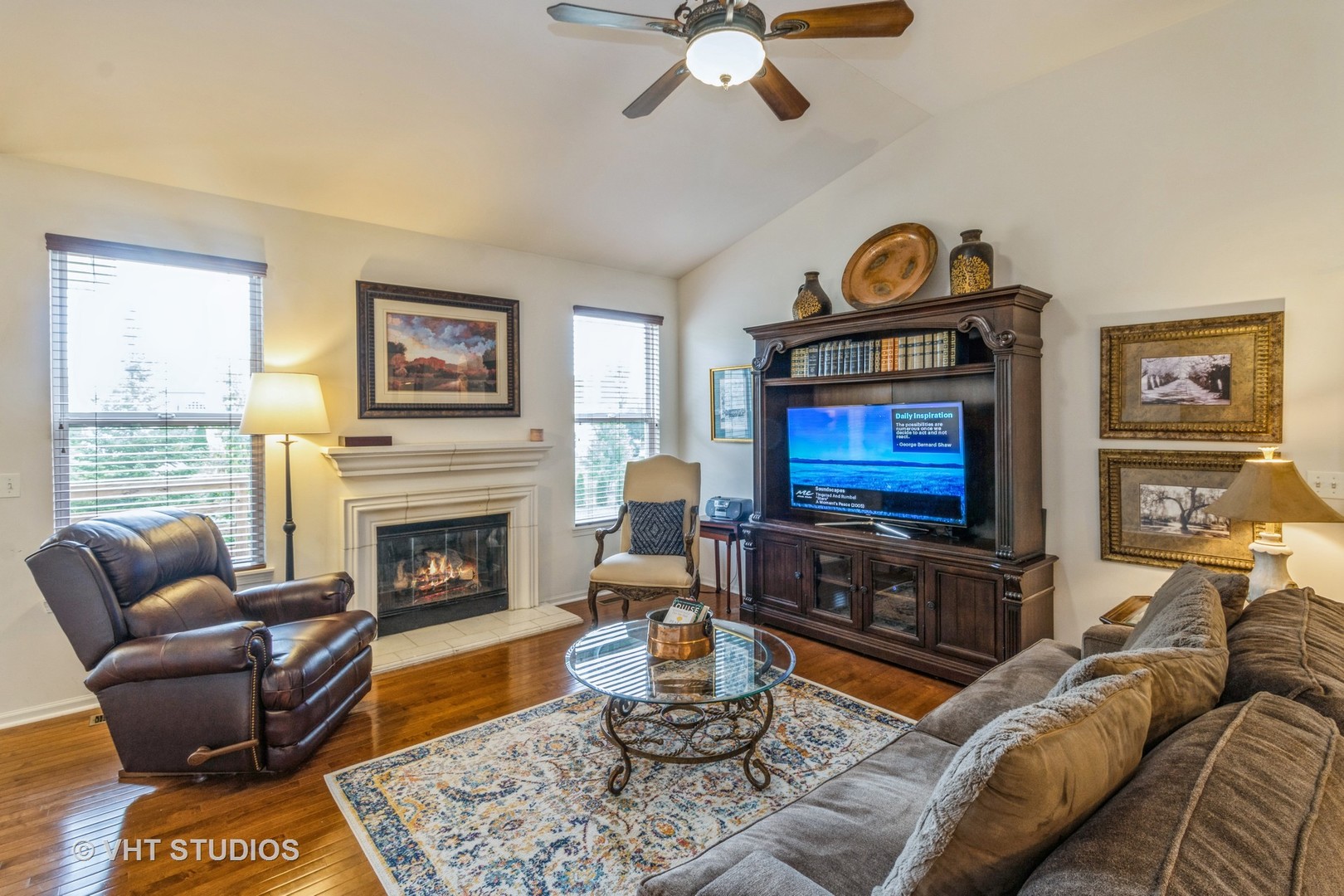 607 Waterford Road Elgin, IL 60124 - Photo 11 of 34 a living room with furniture a fireplace and a flat screen tv