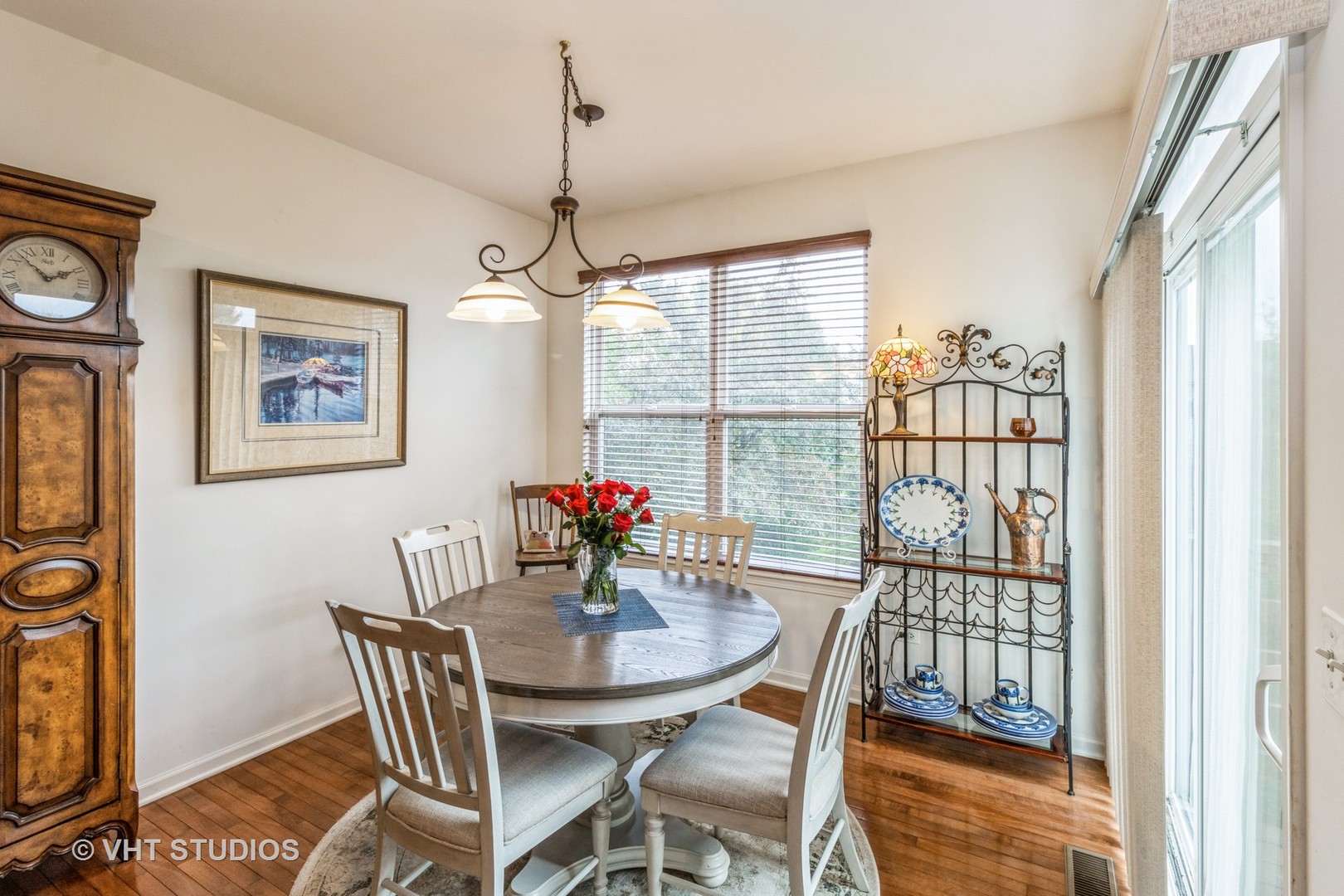 607 Waterford Road Elgin, IL 60124 - Photo 12 of 34 a view of a dining room with furniture window and wooden floor