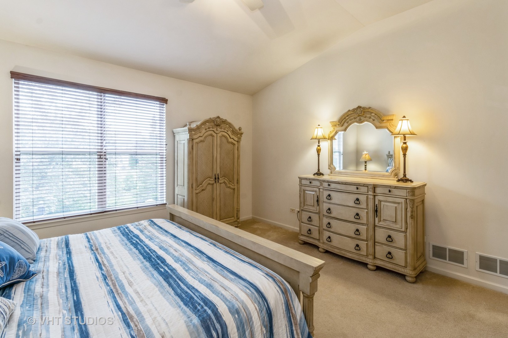 607 Waterford Road Elgin, IL 60124 - Photo 18 of 34 a bedroom with a bed and a dresser