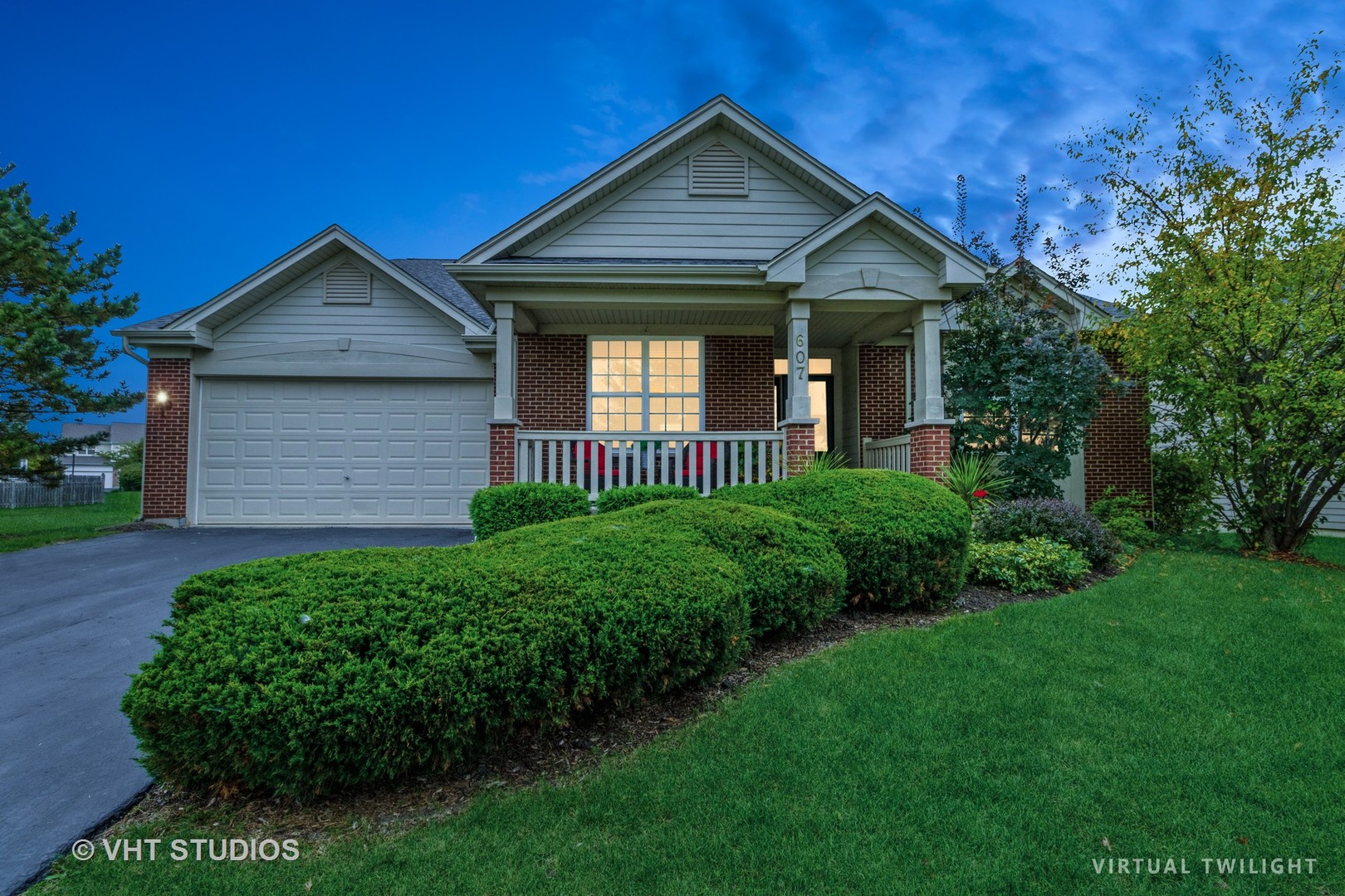 607 Waterford Road Elgin, IL 60124 - Photo 2 of 34 a front view of a house with a yard and porch