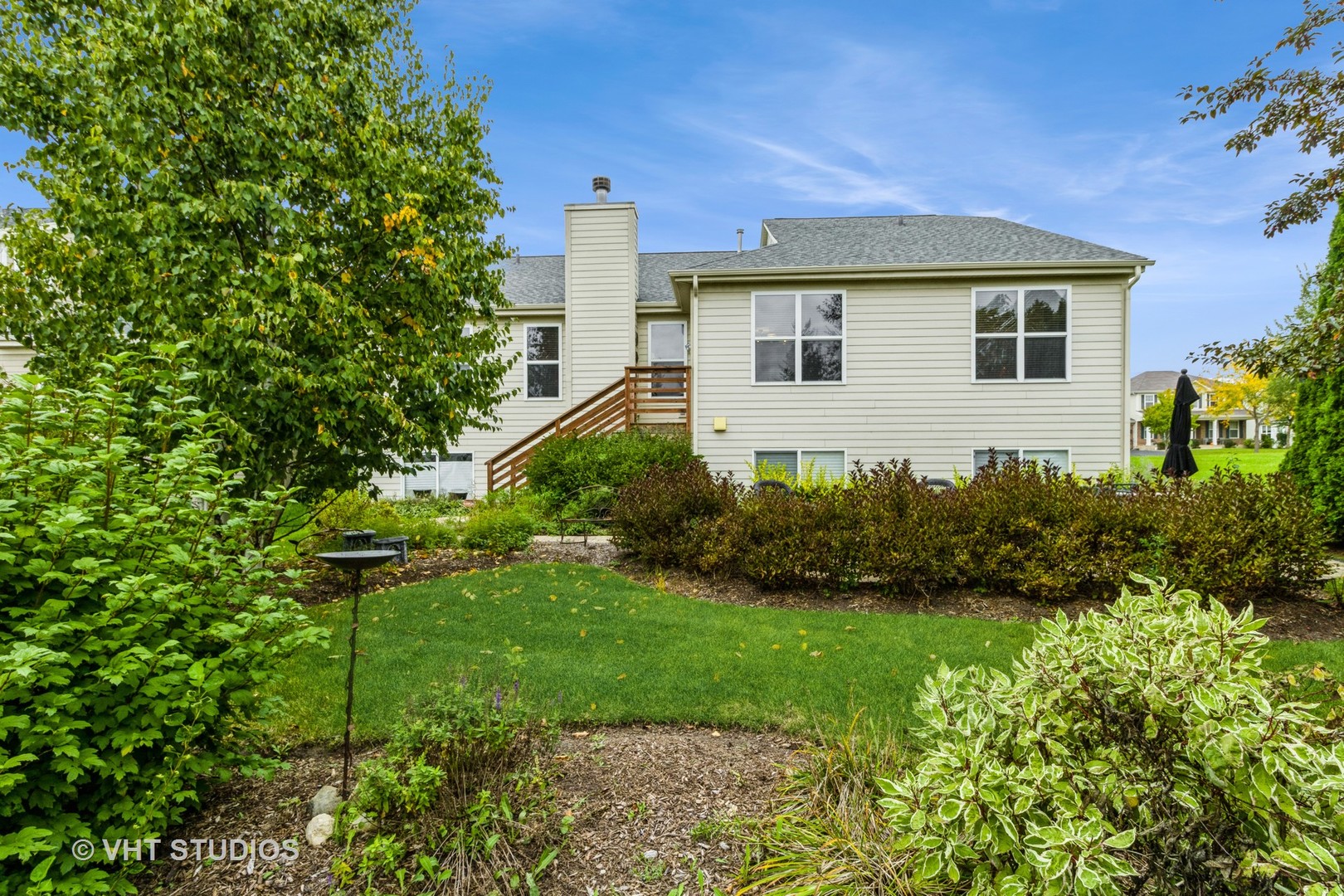 607 Waterford Road Elgin, IL 60124 - Photo 26 of 34 a front view of a house with a garden