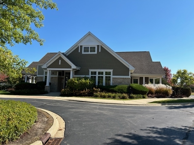 607 Waterford Road Elgin, IL 60124 - Photo 29 of 34 a front view of a house with a yard