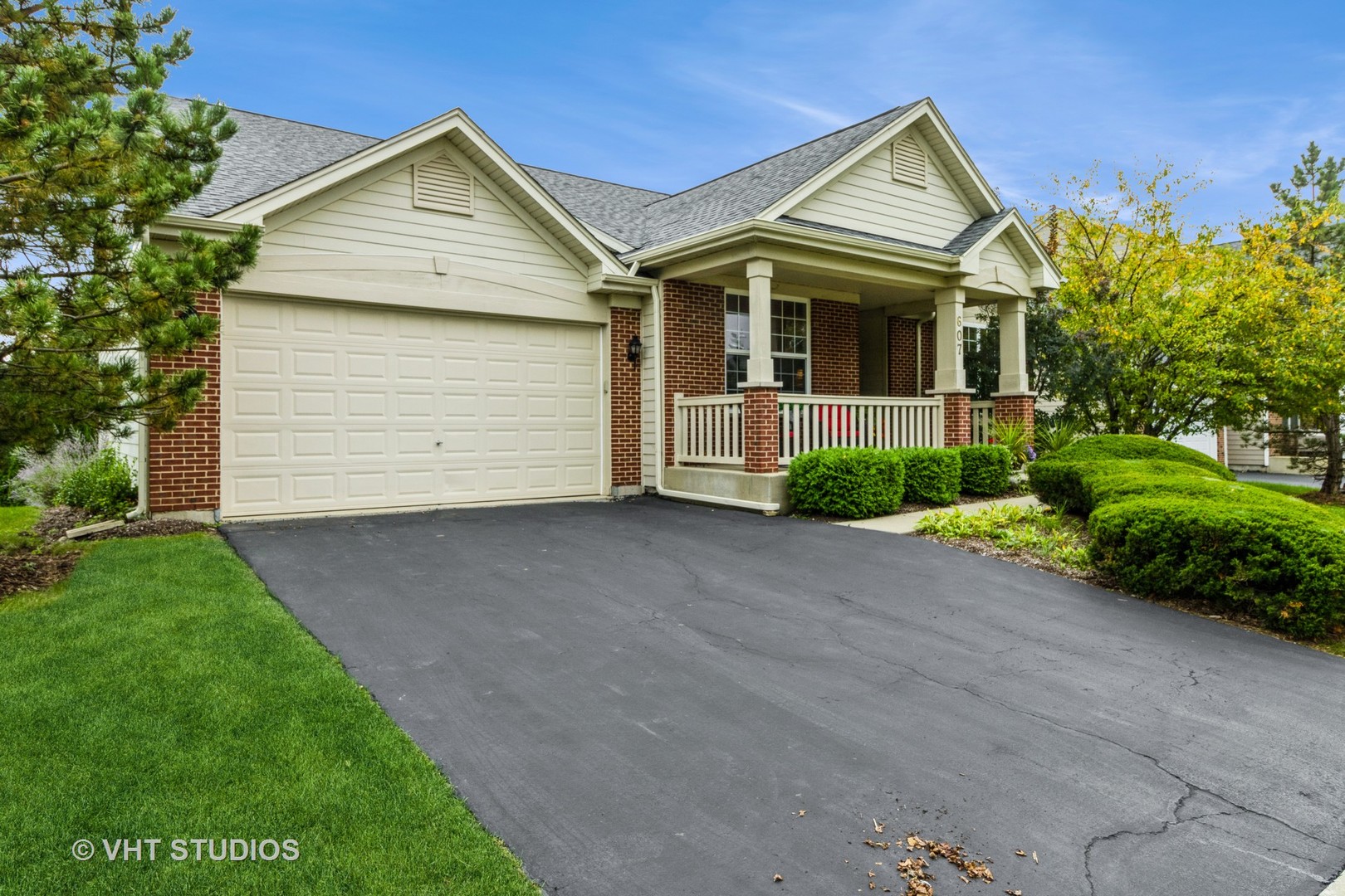 607 Waterford Road Elgin, IL 60124 - Photo 4 of 34 a front view of a house with a garden