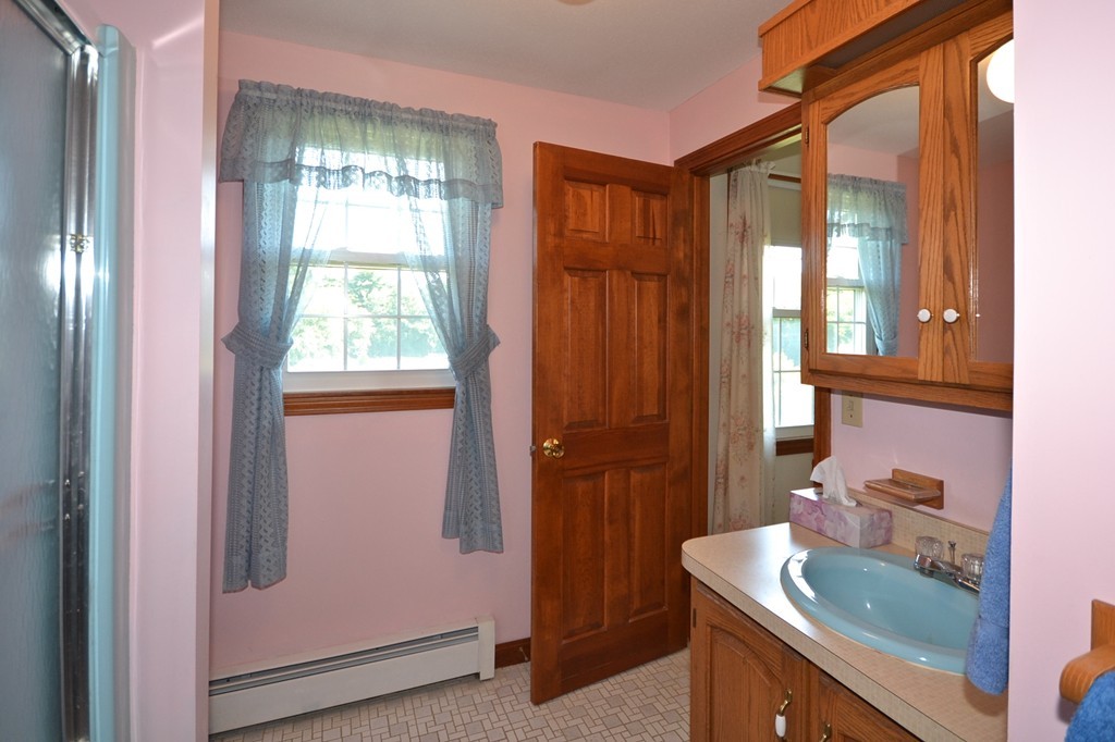 722 Snipatuit Road Rochester, MA 02770 - Photo 11 of 15 a bathroom with a sink a mirror and a shower