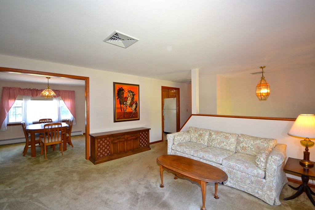 722 Snipatuit Road Rochester, MA 02770 - Photo 3 of 15 a living room with furniture and a table